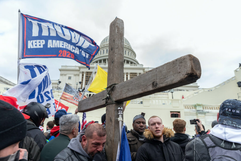 Washington, DC - January 6, 2021 - Pro-Trump protester with Christian Cross seen during rally around at Capitol building