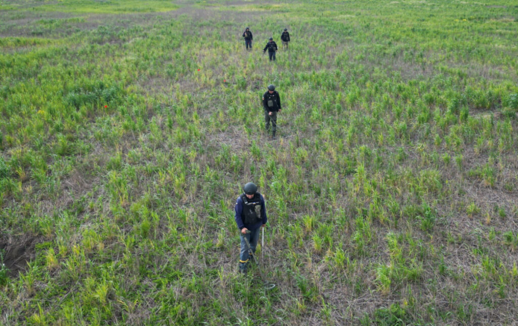 Members of the State of Emergency Service inspect an area for mines and unexploded shells, as Russia's attack on Ukraine continues, near the village of Blahodatne, in Mykolaiv region, Ukraine, on 10th May, 2023.