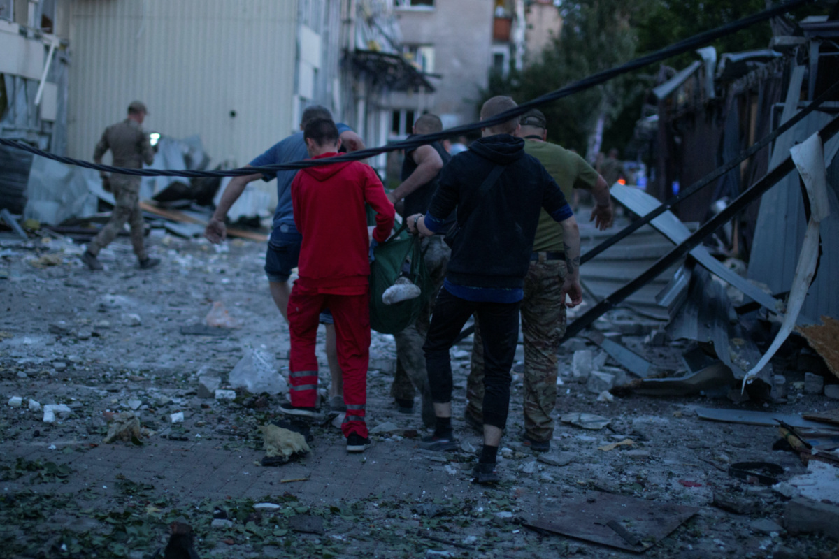 Volunteers carry an injured person at the site of hotel and restaurant buildings heavily damaged by a Russian missile strike, amid Russia's attack on Ukraine, in central Kramatorsk, Donetsk region, Ukraine, on 27th June, 2023.