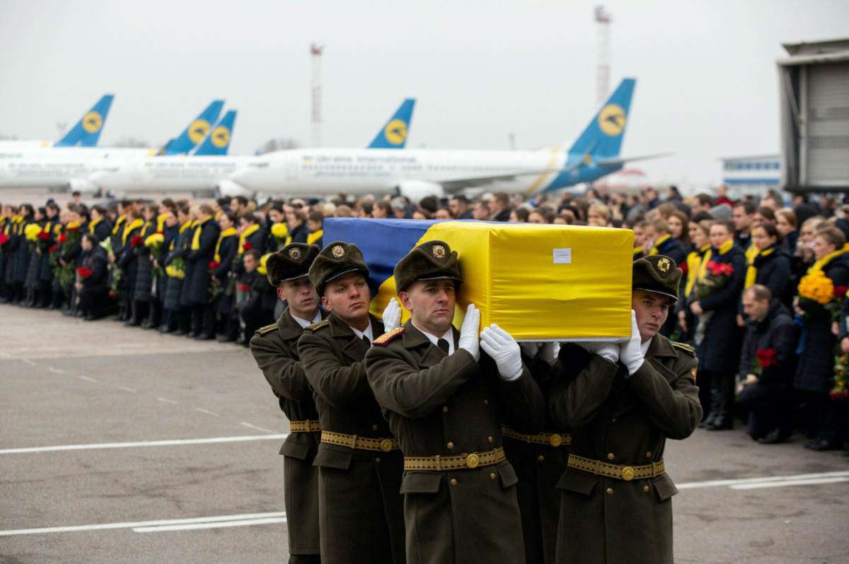 Soldiers carry a coffin containing the remains of one of the eleven Ukrainian victims of the Ukraine International Airlines flight 752 plane disaster during a memorial ceremony at the Boryspil International Airport, outside Kiev, Ukraine, on 19th January, 2020. 
