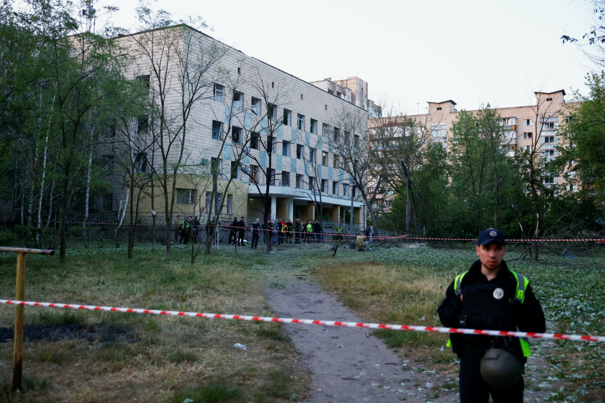 Emergency services personnel near a cordon after a Russian missile strike at a compound of a municipal clinic, amid Russia’s attack on Ukraine, in Kyiv, Ukraine, on 1st June, 2023. 