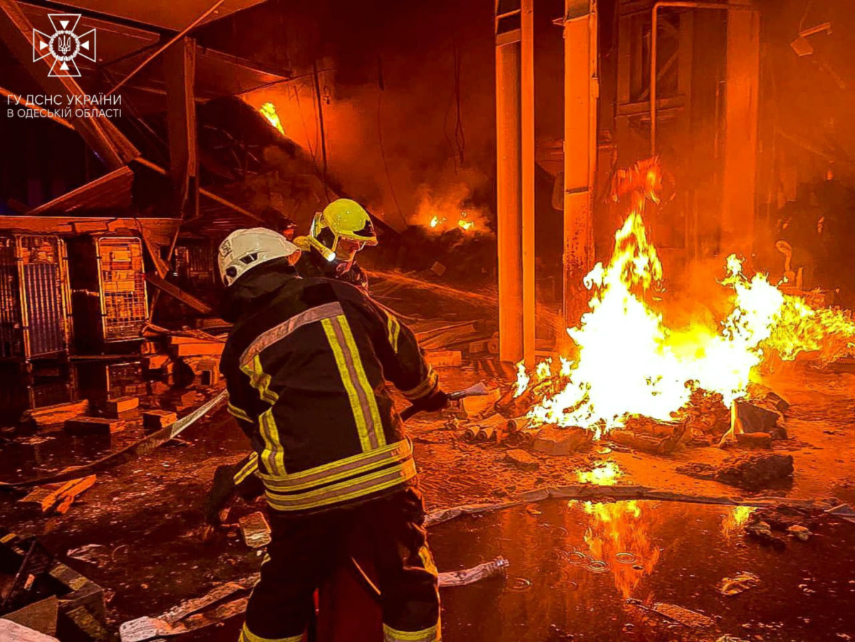 Emergency services personnel work to control a fire at a business centre and the warehouse of a retail chain, caused by a Russian missile strike, amid Russia's attack on Ukraine, in Odesa, Ukraine in this image released on 14th June, 2023.