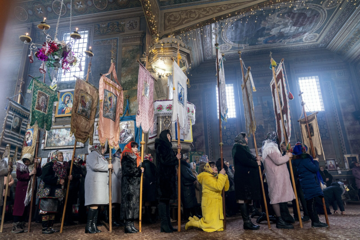 Parishioners attend the Orthodox Christmas Mass in the Holy Trinity church in Iltsi village, Ivano-Frankivsk region of Western Ukraine, on Thursday, 7th January, 2021.
