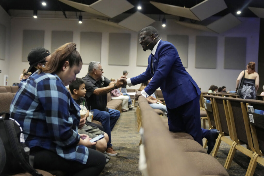 Pastor Les Robinson interacts with members of the congregation at The Sanctuary Church, on Sunday, 14th May, 2023, in Santa Clarita, California