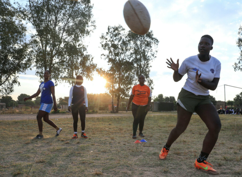Members of the Zimbiru Rugby Academy Club, an all-female rugby team take part in a training session at Zimbiru primary school in Domboshava outside Harare, Zimbabwe, on 2nd May, 2023.