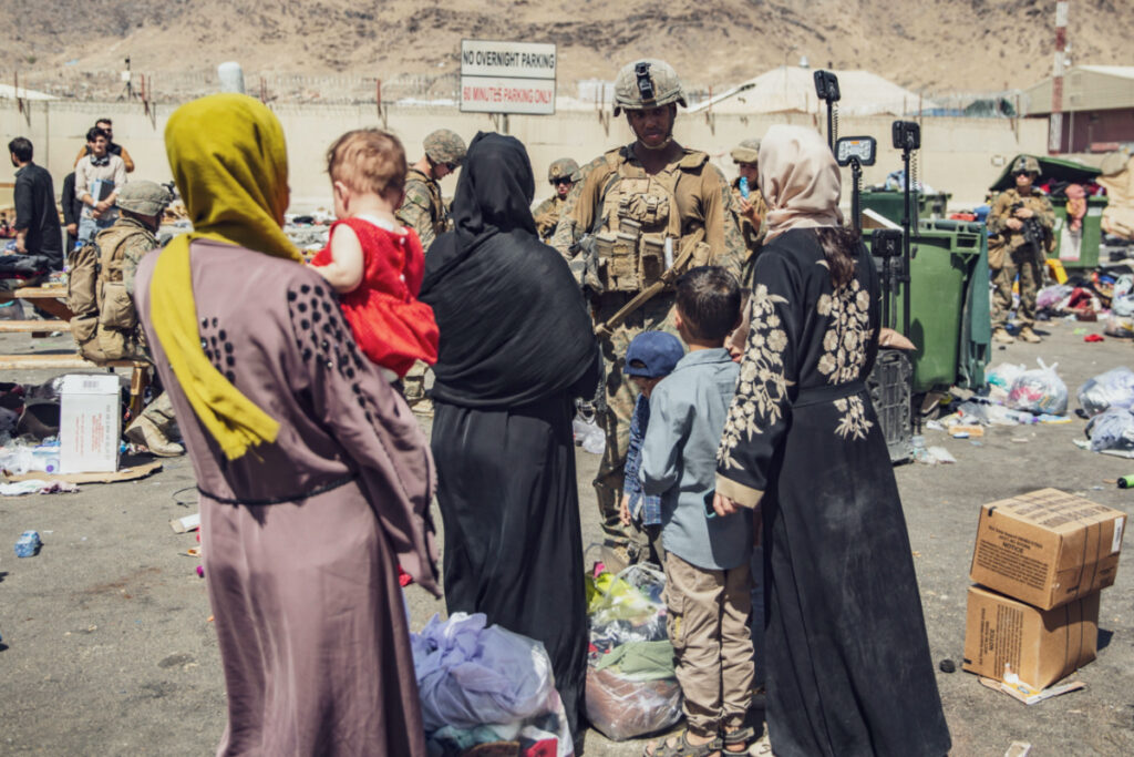 US Marines with the 24th Marine Expeditionary Unit process evacuees as they go through the Evacuation Control Center during an evacuation at Hamid Karzai International Airport, Kabul, Afghanistan, on 28th August, 2021.