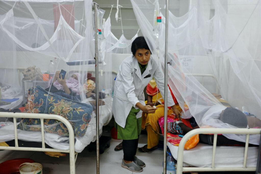 A nurse provides treatment to a dengue-infected patient at the Shaheed Suhrawardy Medical College and Hospital in Dhaka, Bangladesh, on 26th July, 2023.