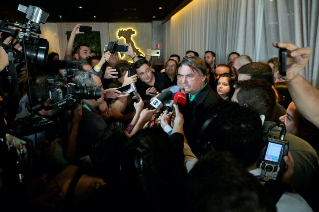 Brazil's former President Jair Bolsonaro talks with media at a restaurant, on the day the Electoral Justice continues the trial to determine his political rights, in Belo Horizonte, Brazil, on 30th June, 2023.