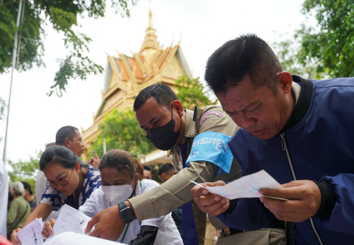 People look at voters lists on the day of Cambodia's general election, in Phnom Penh, Cambodia, on 23rd July, 2023.
