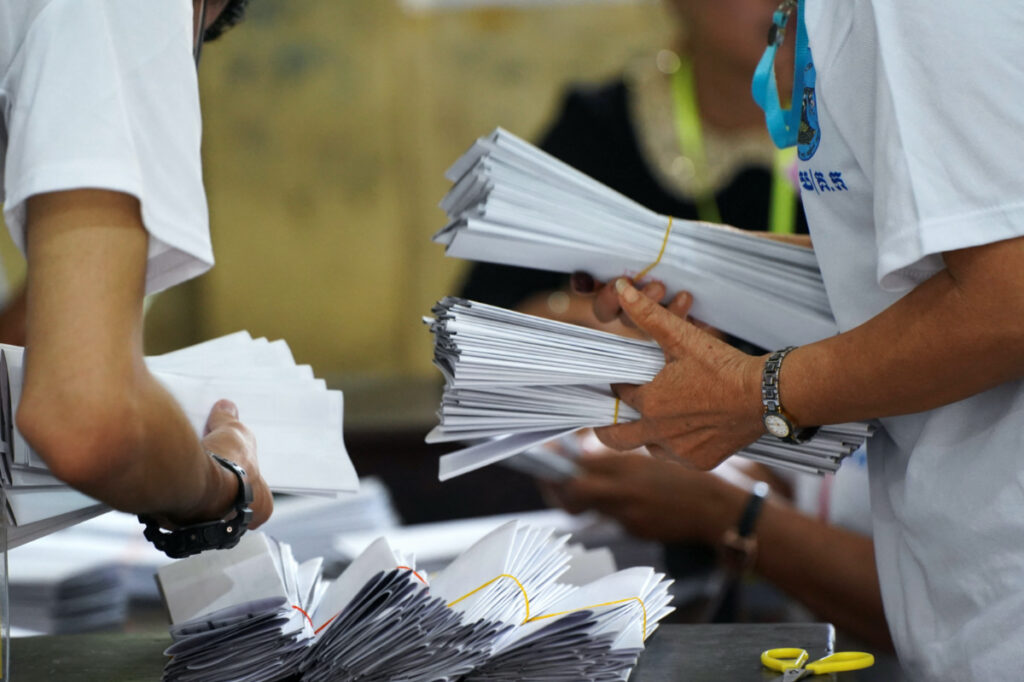 Election officials count ballots at a polling station on the day of Cambodia's general election, in Phnom Penh, Cambodia, on 23rd July, 2023.