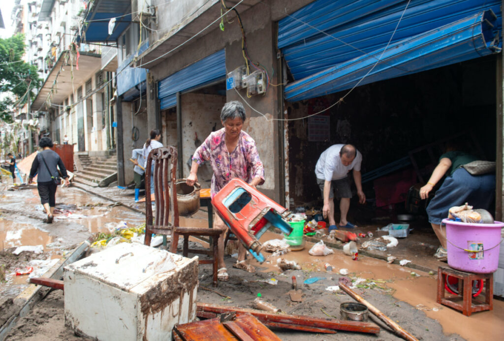 Residents salvage their belongings after heavy rainfall flooded Wanzhou district of Chongqing, China, on 4th July, 2023