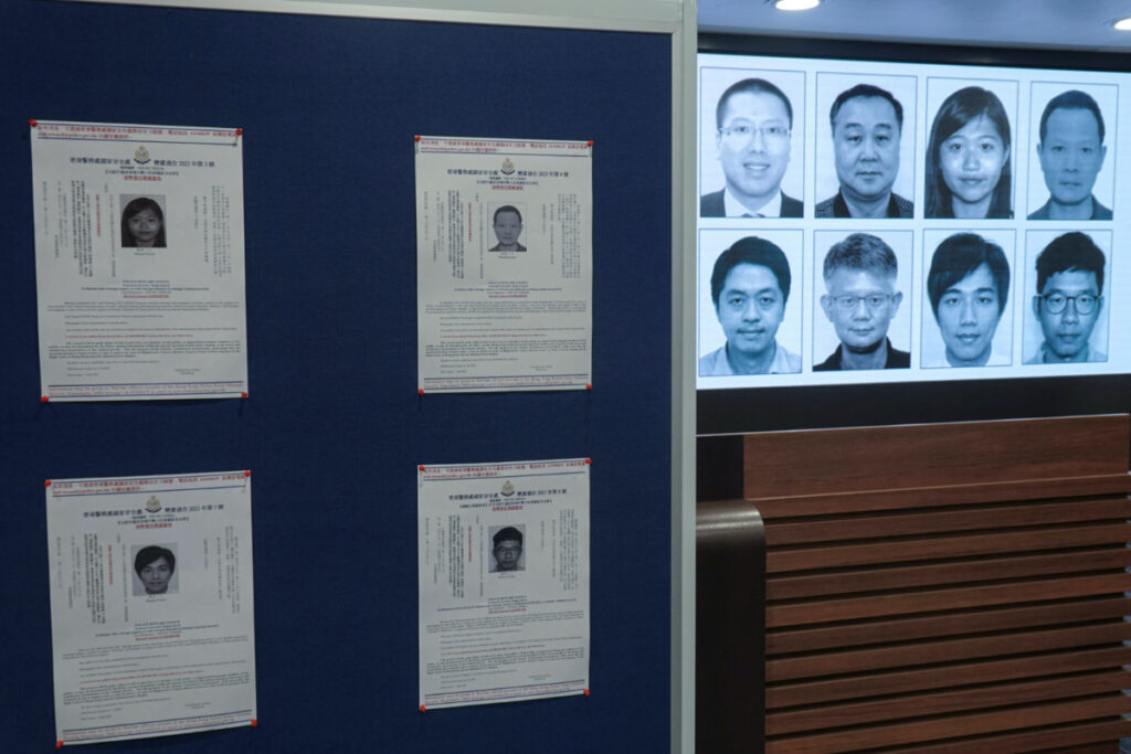Photos of eight activists who have been issued arrest warrants over national security are displayed during a press conference in Hong Kong, China, on 3rd July, 2023