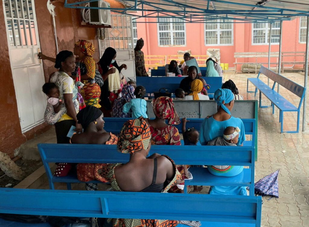 Mothers wait with their children while Health workers prepare routine vaccines for young children at Bundung Maternal and Child Health Hospital in Bundung, Gambia, on 30th August, 2022.