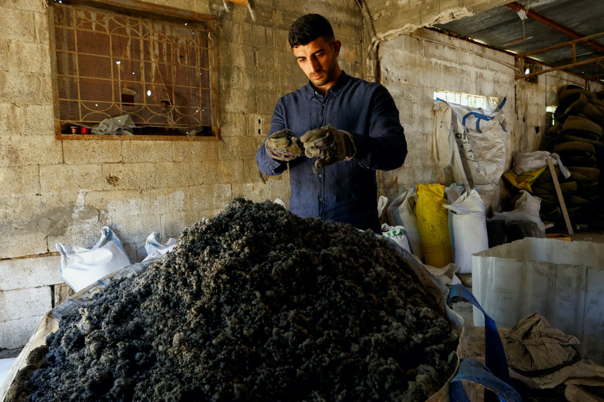 Palestinian Madyan Helles works in his workshop as he turns wasted car tires into environment-friendly materials, in Gaza, on 11th July, 2023. 