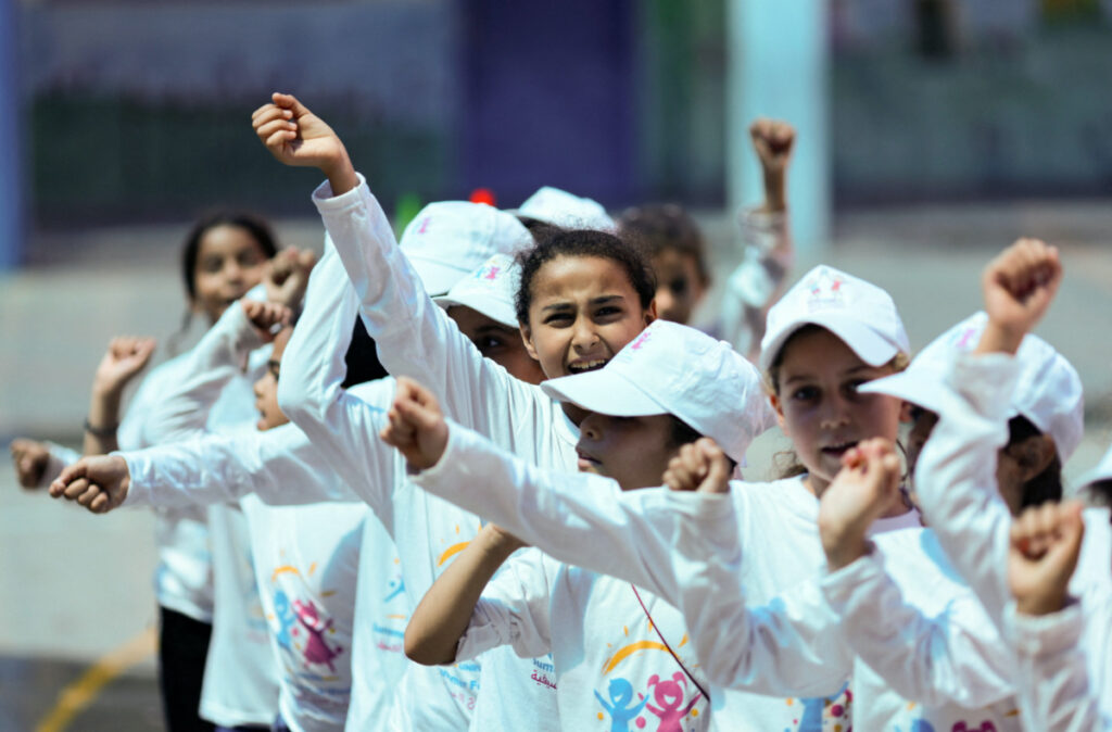 Palestinian refugee students attend an activity as part of Fun Weeks summer camps run by the United Nations Relief and Works Agency in a school in Beach refugee camp in Gaza City, on 11th July, 2023.