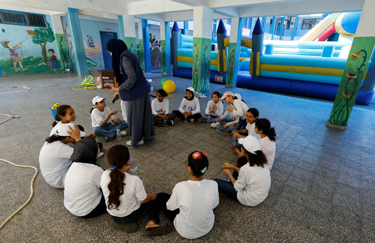 Palestinian refugee students attend an activity as part of "Fun Weeks" summer camps run by the United Nations Relief and Works Agency in a school in Beach refugee camp in Gaza City, on 11th July, 2023. 