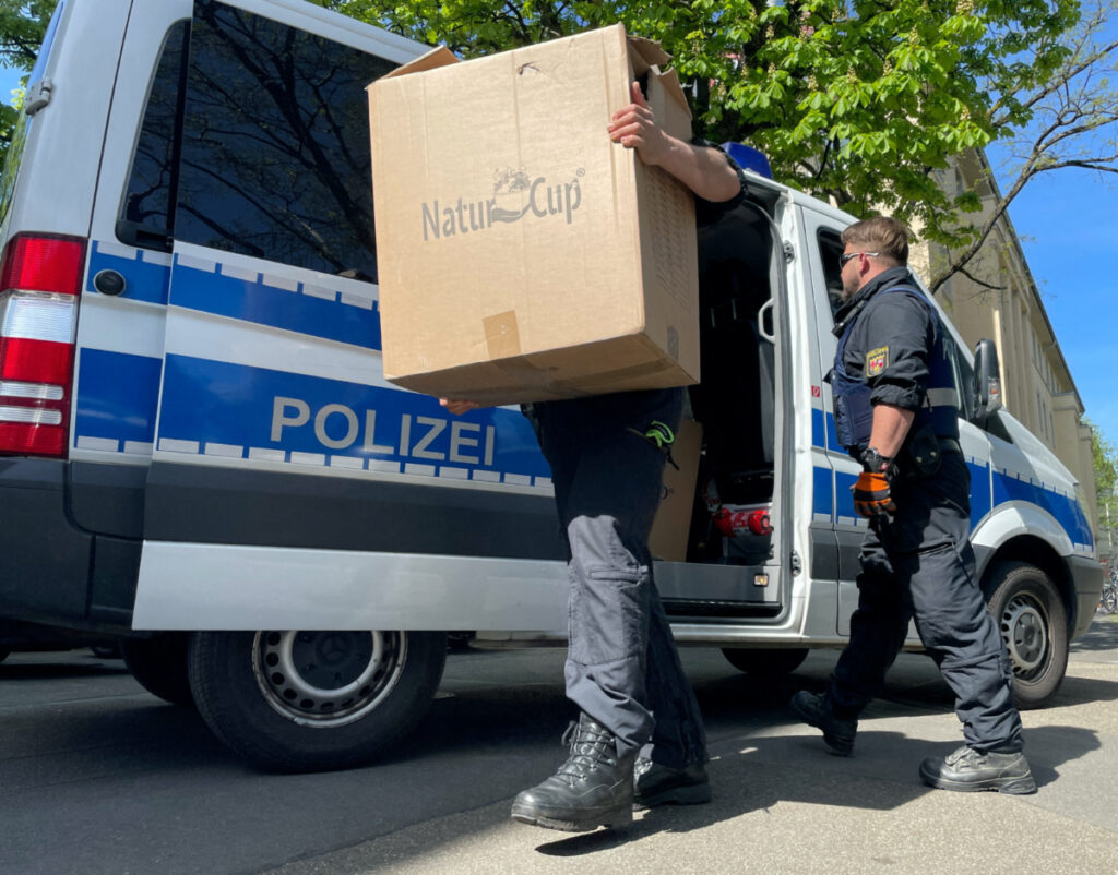 Police officers carry boxes into a police building in Mainz, Germany, May 3, 2023, after German police arrested dozens of people across the country on Wednesday in an investigation of the Italian Ndrangheta organised crime group,