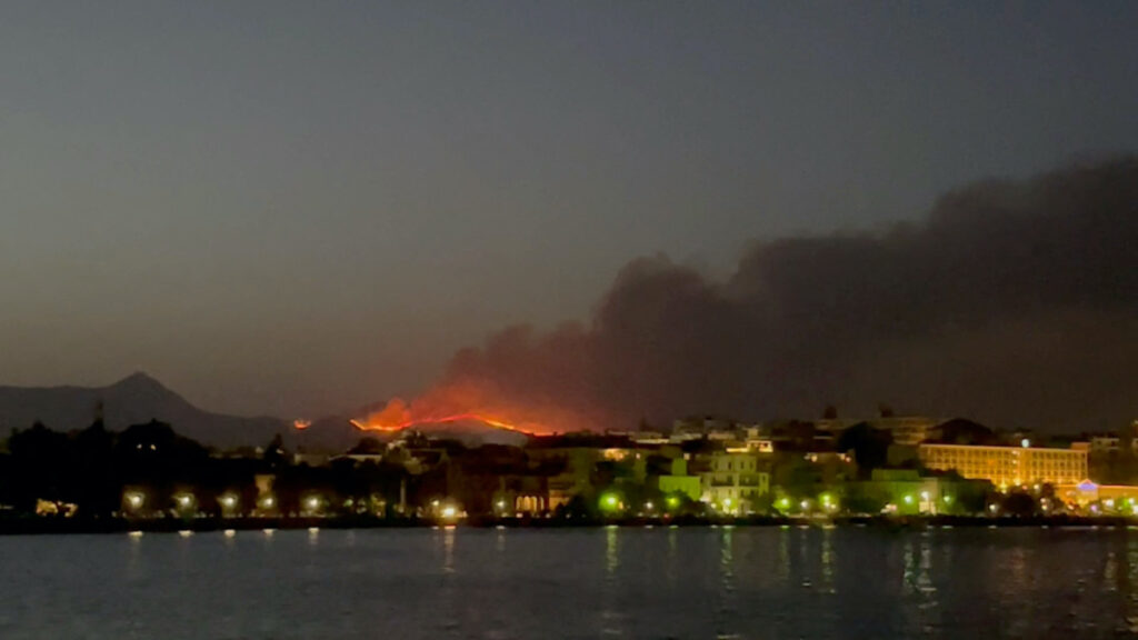 Smoke rises from a wildfire on Corfu Island, Greece, on 23rd July, 2023 in this still image obtained from social media video.