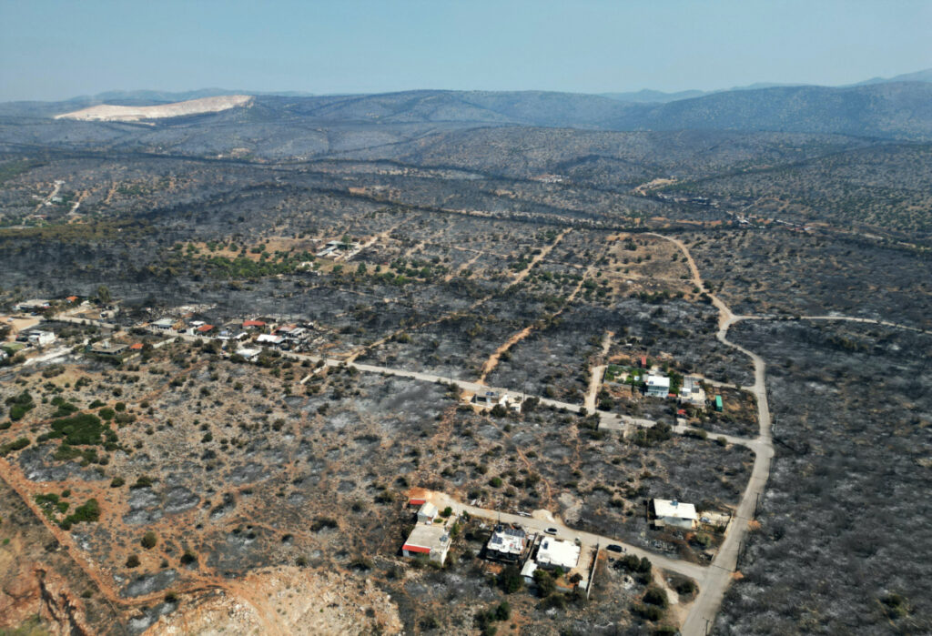 An aerial view shows burnt area following a wildfire at the settlement of Tsakali near Mandra, west of Athens, Greece, on 20th July, 2023.