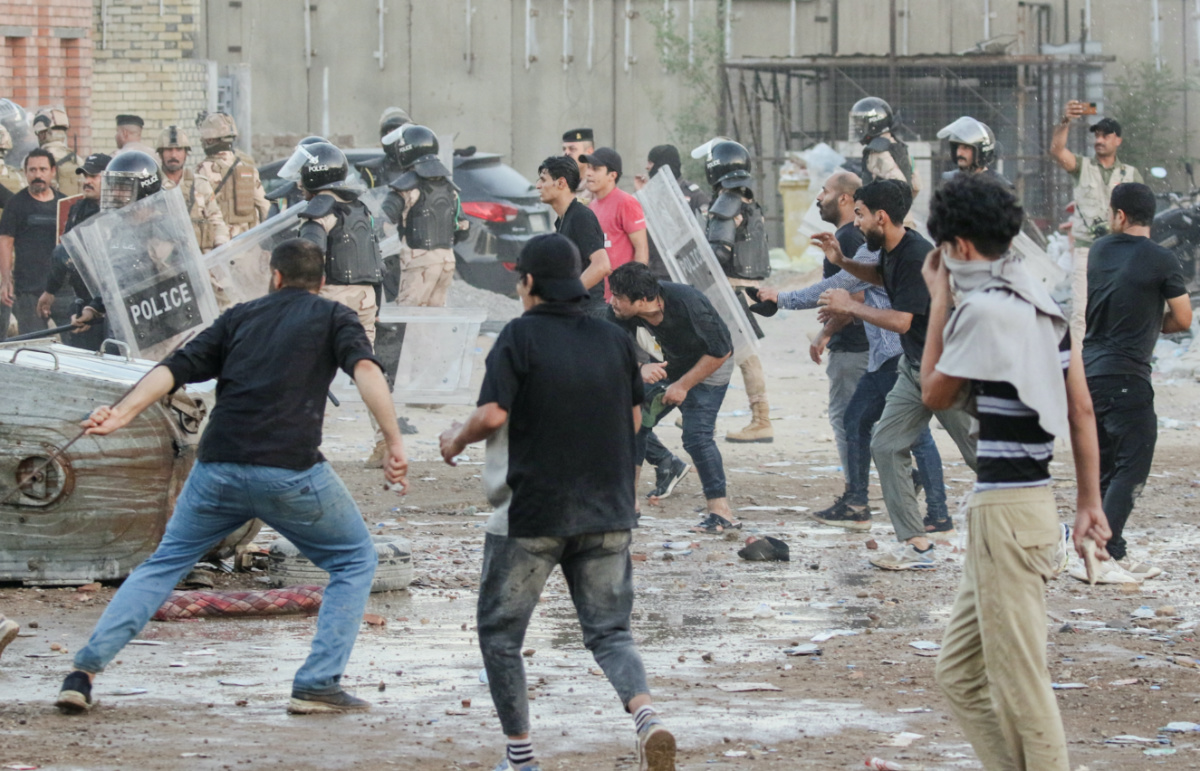 Protesters clash with security forces members as they gather near the Swedish embassy in Baghdad hours after the embassy was stormed and set on fire ahead of an expected Quran burning in Stockholm, in Baghdad, Iraq, on 20th July, 2023.