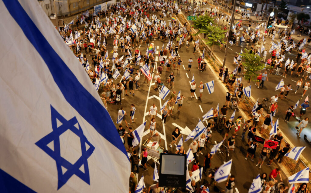 People take part in a demonstration against Israeli Prime Minister Benjamin Netanyahu and his nationalist coalition government's judicial overhaul, in Tel Aviv, Israel, on 29th July, 2023