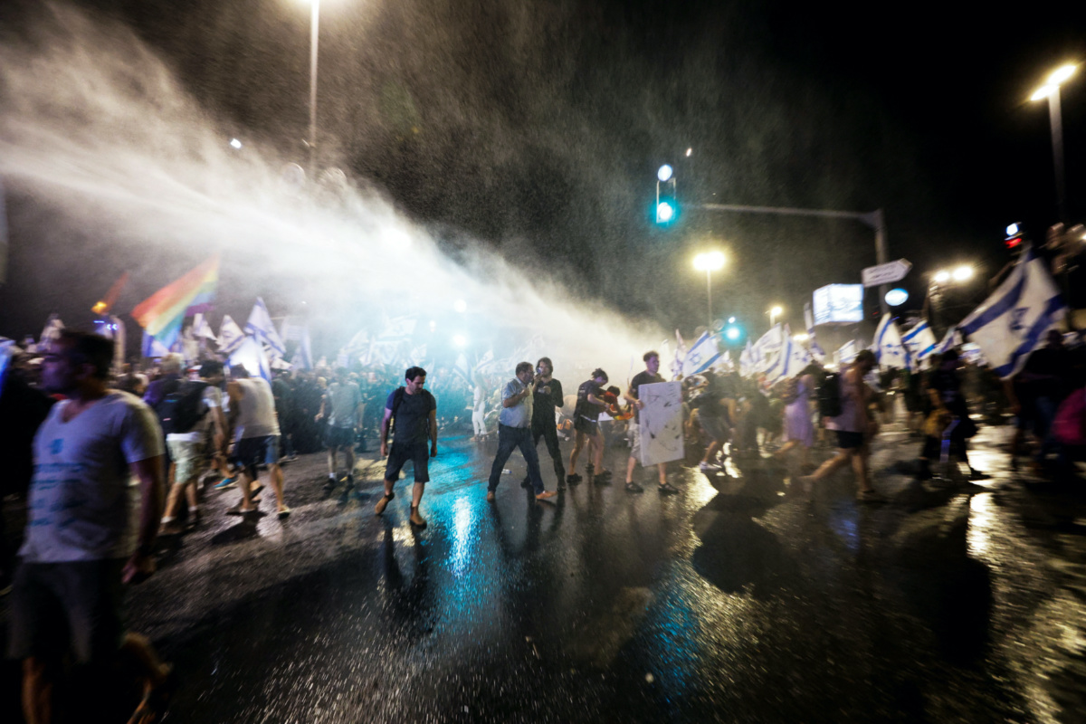 Police use a water cannon during a demonstration following a parliament vote on a contested bill that limits Supreme Court powers to void some government decisions, near the Knesset in Jerusalem, on 24th July, 2023. 