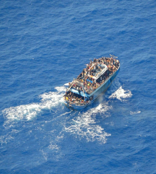 An undated handout photo provided by the Hellenic Coast Guard shows migrants onboard a boat during a rescue operation, before their boat capsized on the open sea, off Greece, on 14th June, 2023. 
