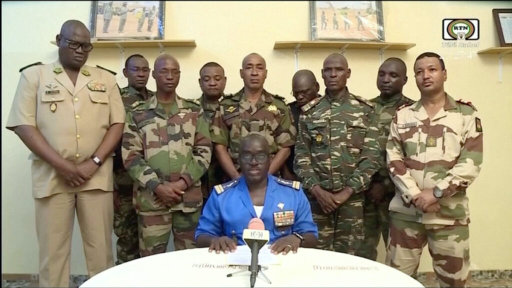 Niger Army spokesman Colonel Major Amadou Adramane speaks during an appearance on national television, after President Mohamed Bazoum was held in the presidential palace, in Niamey, Niger, on 26th July, 2023 in this still image taken from video.