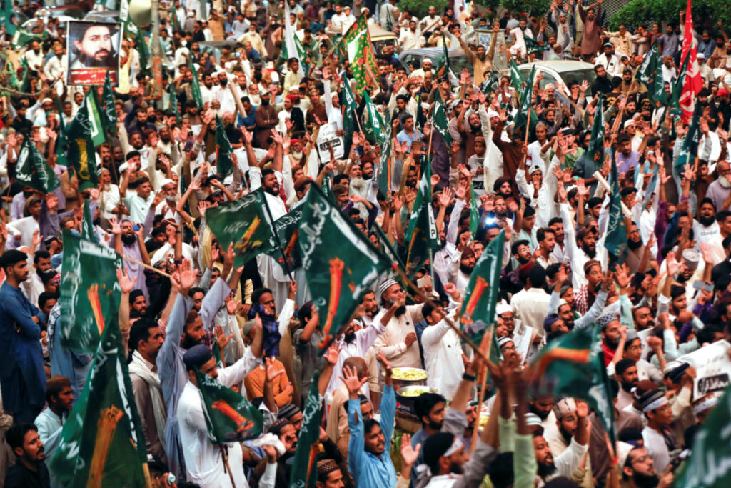 Supporters of the Tehreek-e-Labbaik Pakistan, a religious and political party, chant slogans as they gather during a protest to denounce the desecration of Koran outside a mosque in the Swedish capital Stockholm, in Karachi, Pakistan, on 7th July, 2023.