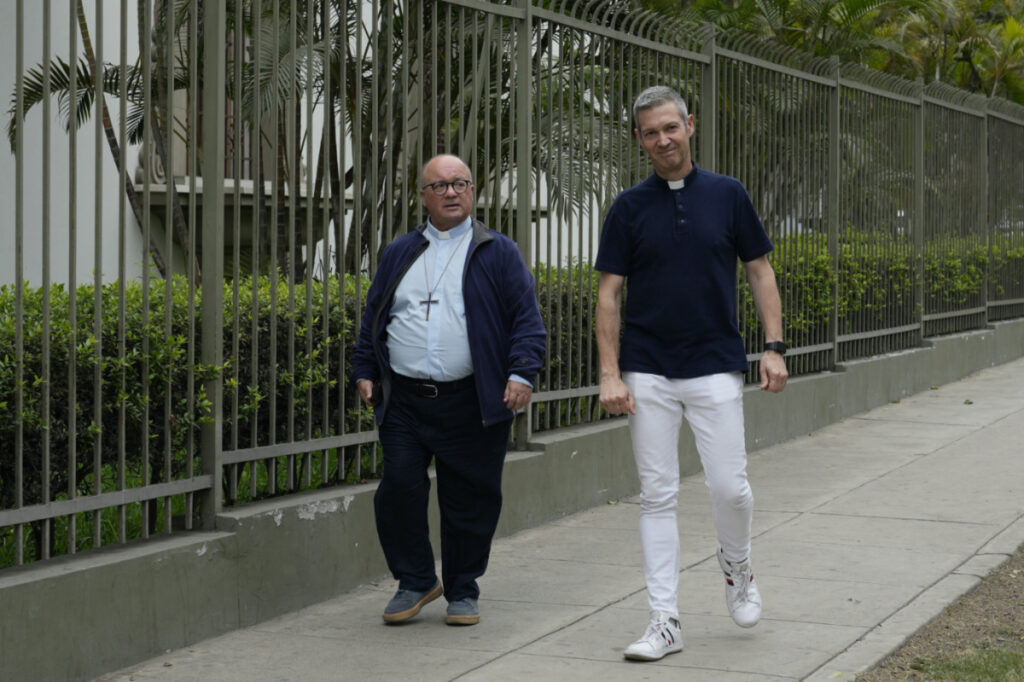 Vatican investigators, Archbishop Charles Scicluna, from Malta, left, and Monsignor Jordi Bertomeu, from Spain, walk outside of the Nunciatura Apostolica during a break from meeting with people who allege abuse by the Catholic lay group Sodalitium Christianae Vitae in Lima, Peru, Tuesday, on 25th July, 2023.
