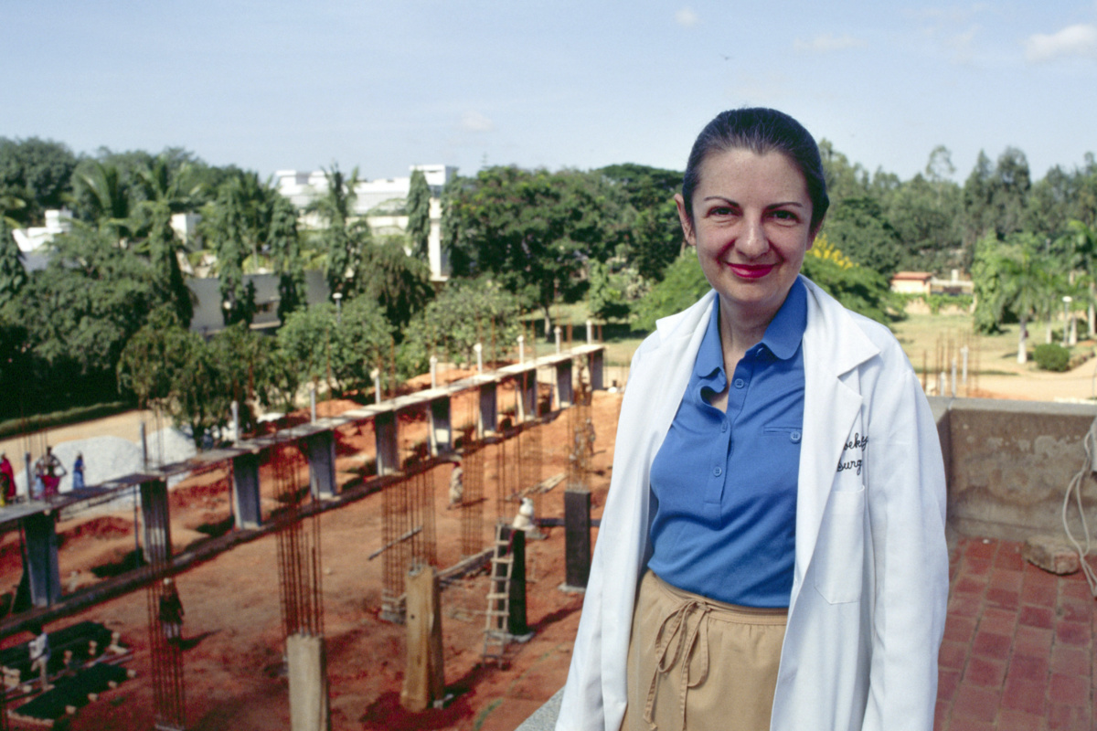 Dr Rebekah Naylor stands in front of part of Bangalore Baptist Hospital’s expansion construction project in Bangalore, India, in 1990.