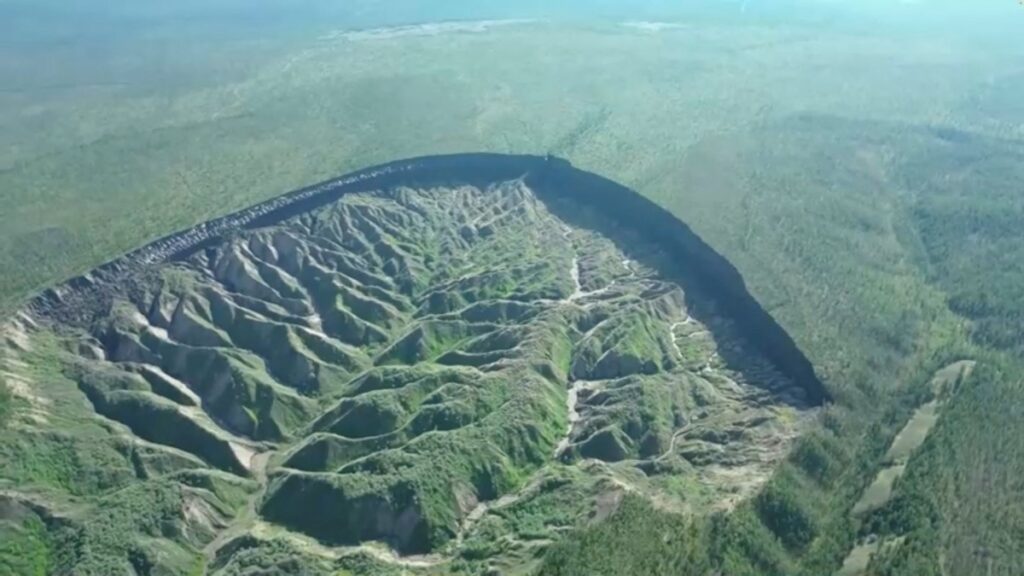 A view of the Batagaika crater, as permafrost thaws causing a megaslump in the eroding landscape, in Russia's Sakha Republic in this still image from video taken July 11 or 12, 2023.
