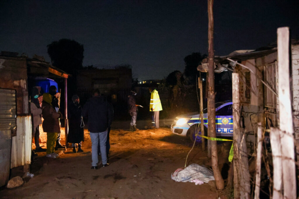 Police stand guard at the scene following a suspected gas leak thought to be linked to illegal mining, in the Angelo shack settlement, near Boksburg, east of Johannesburg, South Africa, on 6th July, 2023.