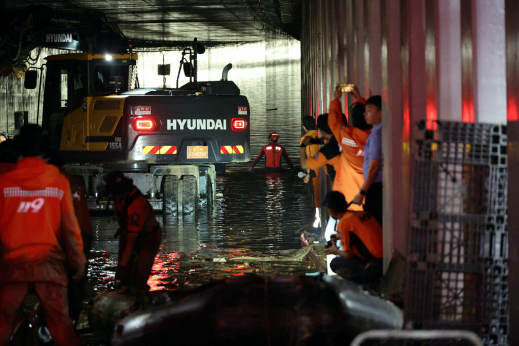 Rescue workers take part in a search and rescue operation inside an underpass that has been submerged by a flooded river caused by torrential rain in Cheongju, South Korea, on 17th July, 2023.
