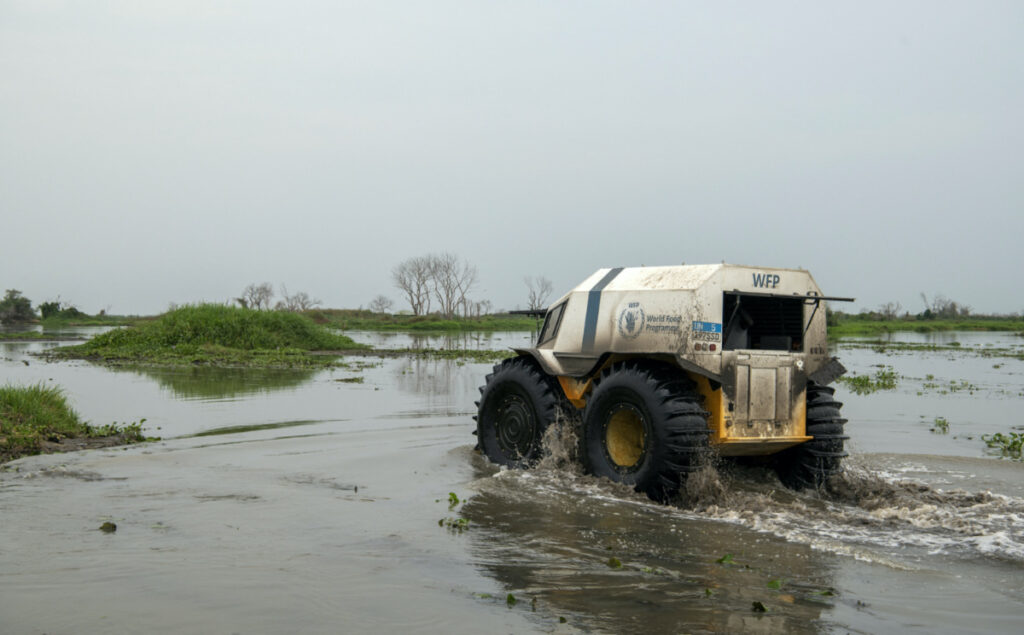 An all-terrain "Sherp" vehicle, operated by World Food Programme, is driven through floodwaters, to deliver aid to vulnerable communities, in Twic East, Jonglei State, South Sudan, on 9th March, 2023.