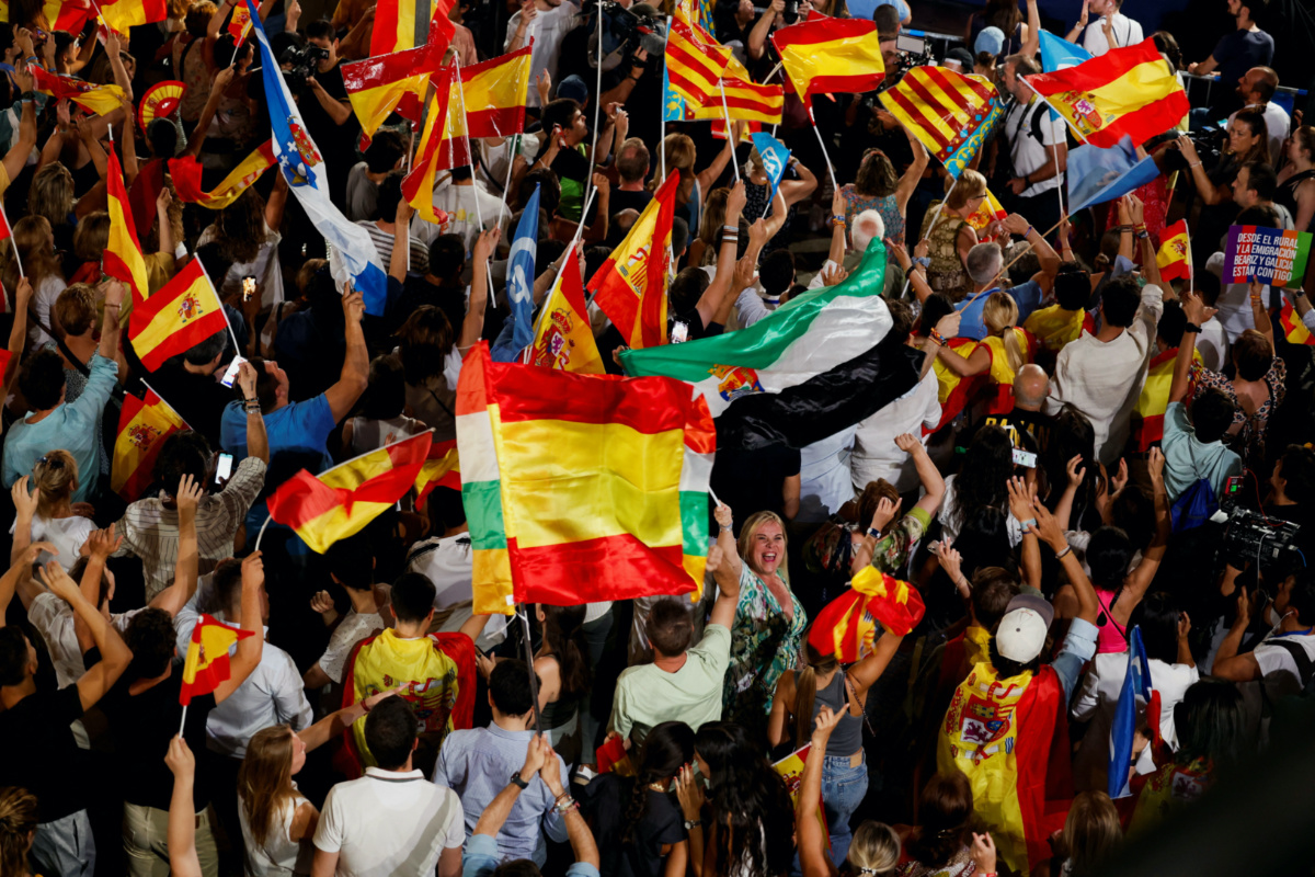 Supporters of Spain's opposition People's Party wave flags outside the party's headquarters on the day of the general election, in Madrid, Spain, on 23rd July, 2023. 