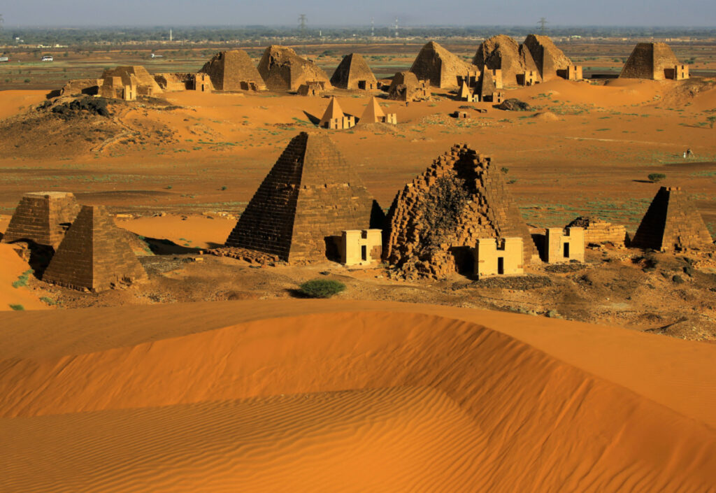 Creeping desert sands surround the Royal Cemeteries of Meroe Pyramids at Begrawiya in River Nile State, Sudan, on 10th November, 2019