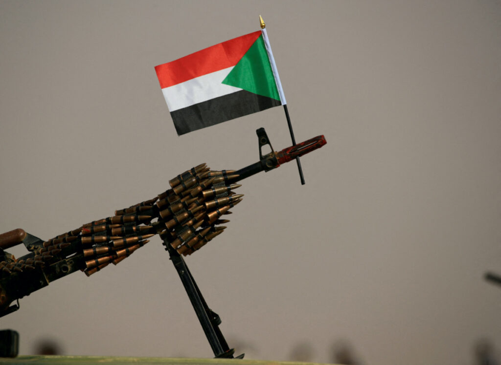A Sudanese national flag is attached to a machine gun of Paramilitary Rapid Support Forces soldiers as they wait for the arrival of Lieutenant General Mohamed Hamdan Dagalo, deputy head of the military council and head of RSF, before a meeting in Aprag village 60, kilometers away from Khartoum, Sudan, on 22nd June, 2019.