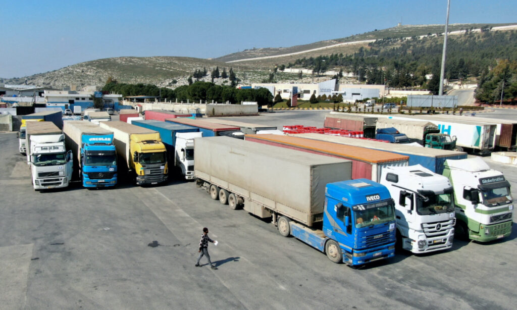 Trucks carrying aid from UN World Food Programme, following a deadly earthquake, are parked at Bab al-Hawa crossing, Syria, on 20th February, 2023.