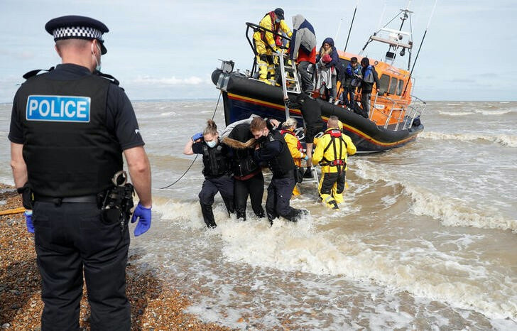 A RNLI boat, with migrants onboard, is met by Border Force Officers and Police at the harbour in Dungeness, Britain, on 13th September, 2021.