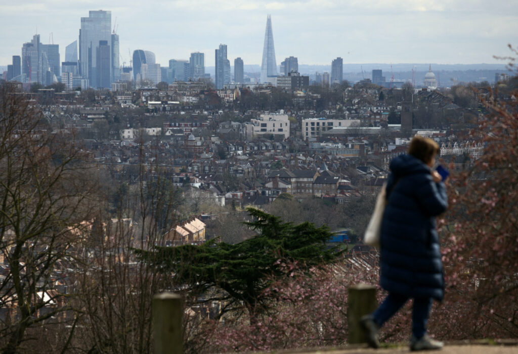 Rows of houses lie in front of the City of London skyline in London, Britain, on 19th March, 2023.