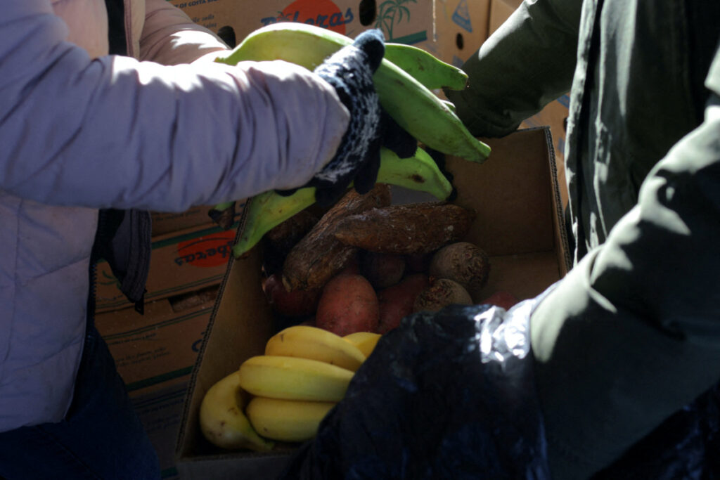 Residents pick up free groceries at a food pantry run by La Colaborativa, as the US is cutting benefits delivered through the Supplemental Nutrition Assistance Program by the end of March which kept millions from going hungry through the COVID-19 pandemic, in Chelsea, Massachusetts, US, on 8th March, 2023.