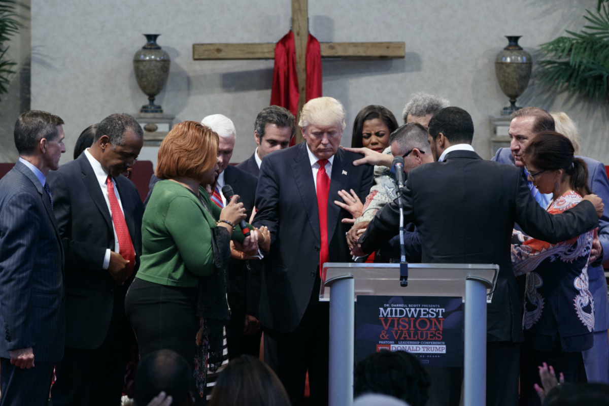 People lay hands on Republican presidential candidate Donald Trump as they pray during a visit to the Pastors Leadership Conference at New Spirit Revival Center, Wednesday, on 21st September, 2016, in Cleveland, Ohio.