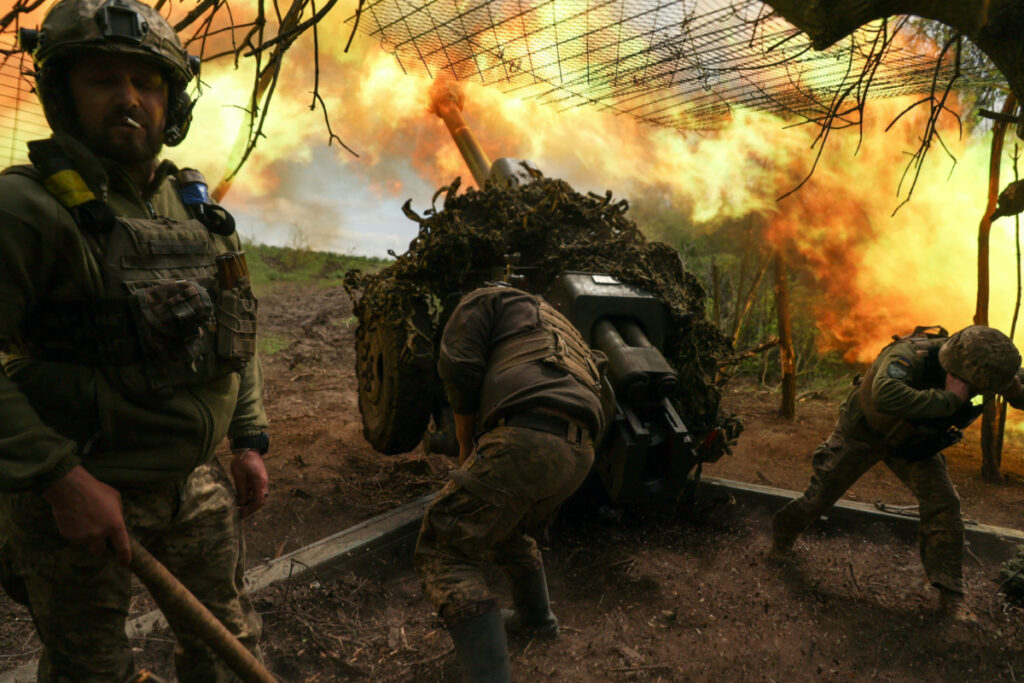 Ukrainian servicemen of the 10th Mountain Assault Brigade 'Edelweiss' fire a D-30 howitzer towards Russian troops at a position in a front line, amid Russia’s attack on Ukraine, near the town of Soledar, Donetsk region, Ukraine, on 6th May, 2023.