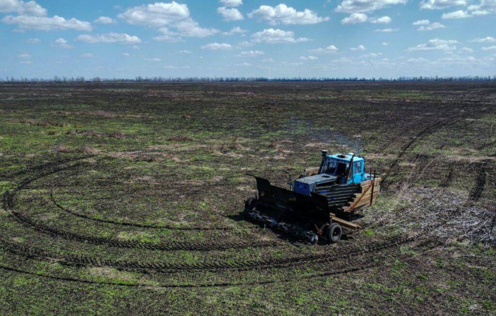 A remote controlled demining machine, created by local farmer Oleksandr Kryvtsov with his tractor and armoured plates from destroyed Russian military vehicles, is seen during demining of an agricultural field, amid Russia's attack on Ukraine, near the village of Hrakove, in Kharkiv region, Ukraine, on 26th April, 2023.