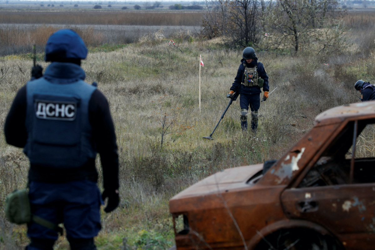 Ukrainian mine experts scan for unexploded ordnance and landmines by the main road to Kherson, Ukraine, on 16th November, 2022. 