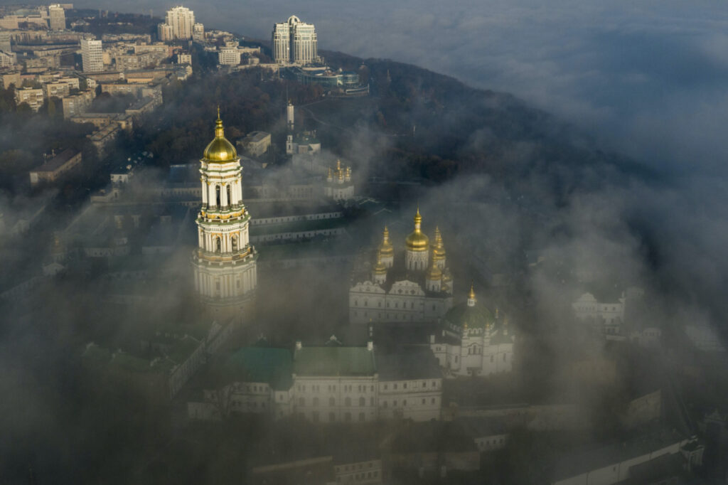 An aerial photo shows the thousand-year-old Monastery of Caves, also known as Kiev Pechersk Lavra, the holiest site of Eastern Orthodox Christians taken through morning fog during a sunrise in Kyiv, Ukraine, on Saturday, 10th November, 2018.