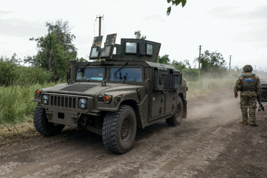 A Humvee vehicle moves along a road near a the recently retaken village of Novodarivka, amid Russia's attack on Ukraine, in Zaporizhzhia region, Ukraine on 2nd July, 2023.