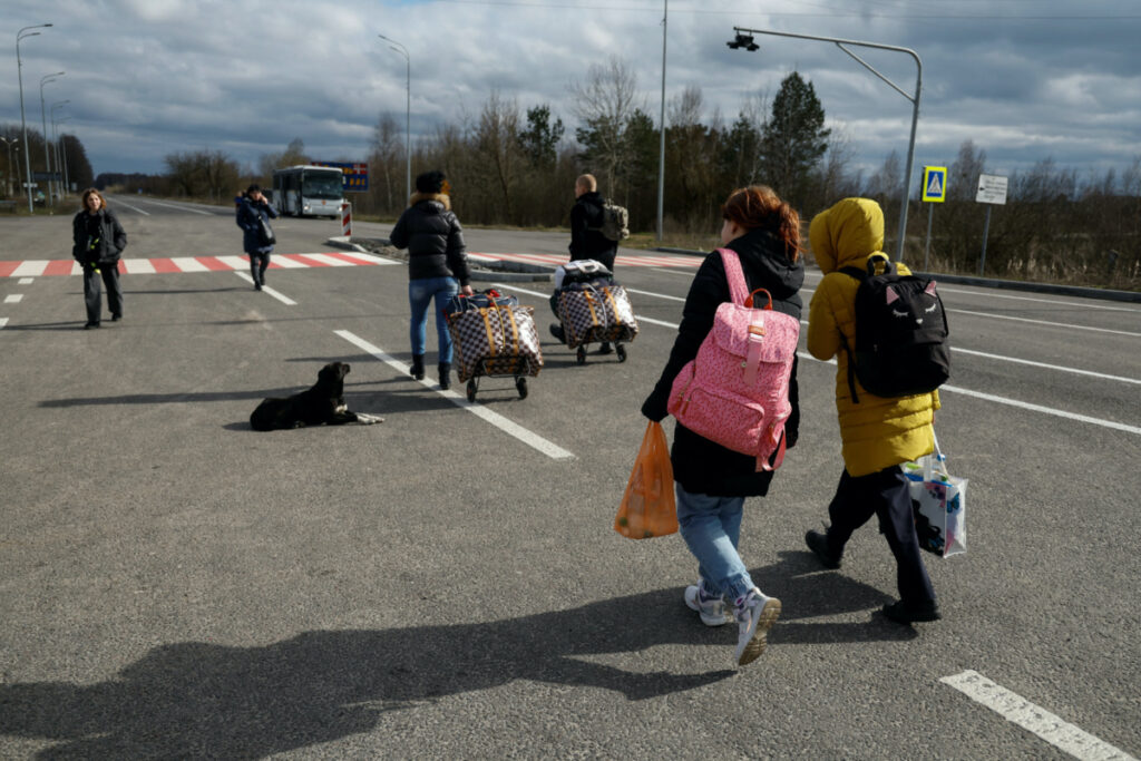 Children, who went to a Russian-organised summer camp from non-government controlled territories and were then taken to Russia, walk to a bus after returning via the Ukraine-Belarus border in Volyn region, Ukraine, on 7th April 2023.