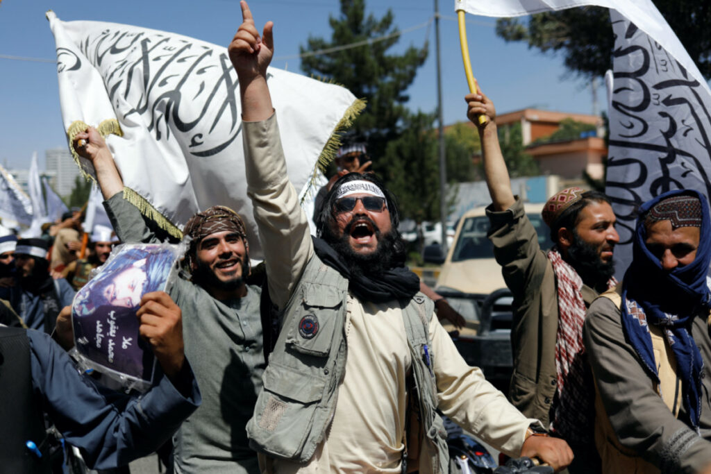 Taliban members rejoice on the second anniversary of the fall of Kabul on a street near the US embassy in Kabul, Afghanistan, on 15th August, 2023.